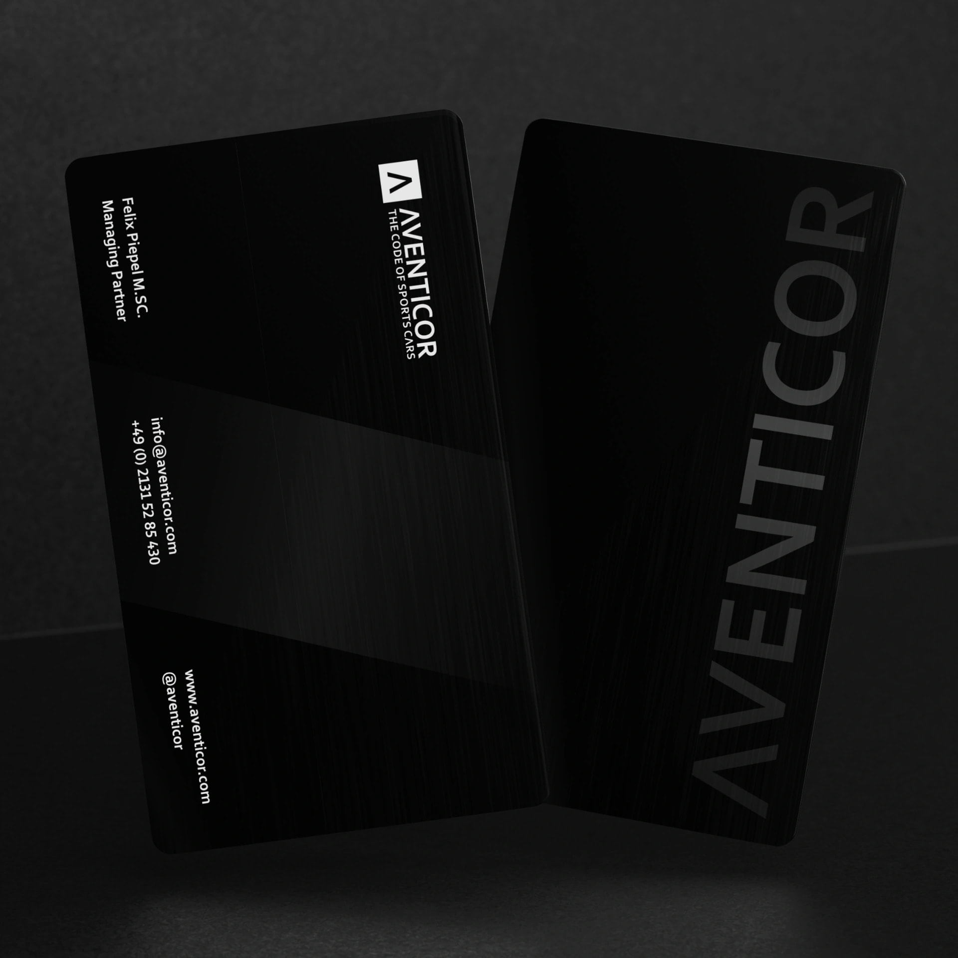 Elegante schwarze Visitenkarten fuer Aventicor mit Logo und Kontaktdaten im edlen Corporate Design
